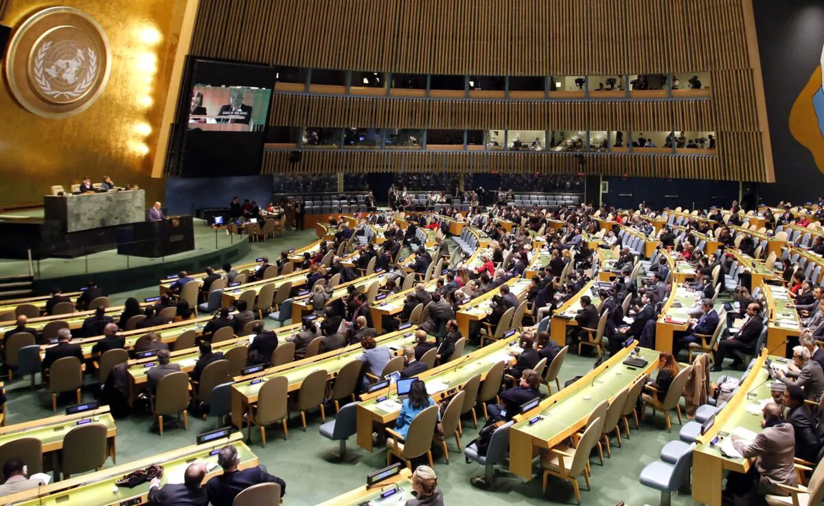 People gather at the General Assembly, prior to a vote, Thursday, Dec. 21, 2017, at United Nations headquarters.   (AP Photo/Mark Lennihan)