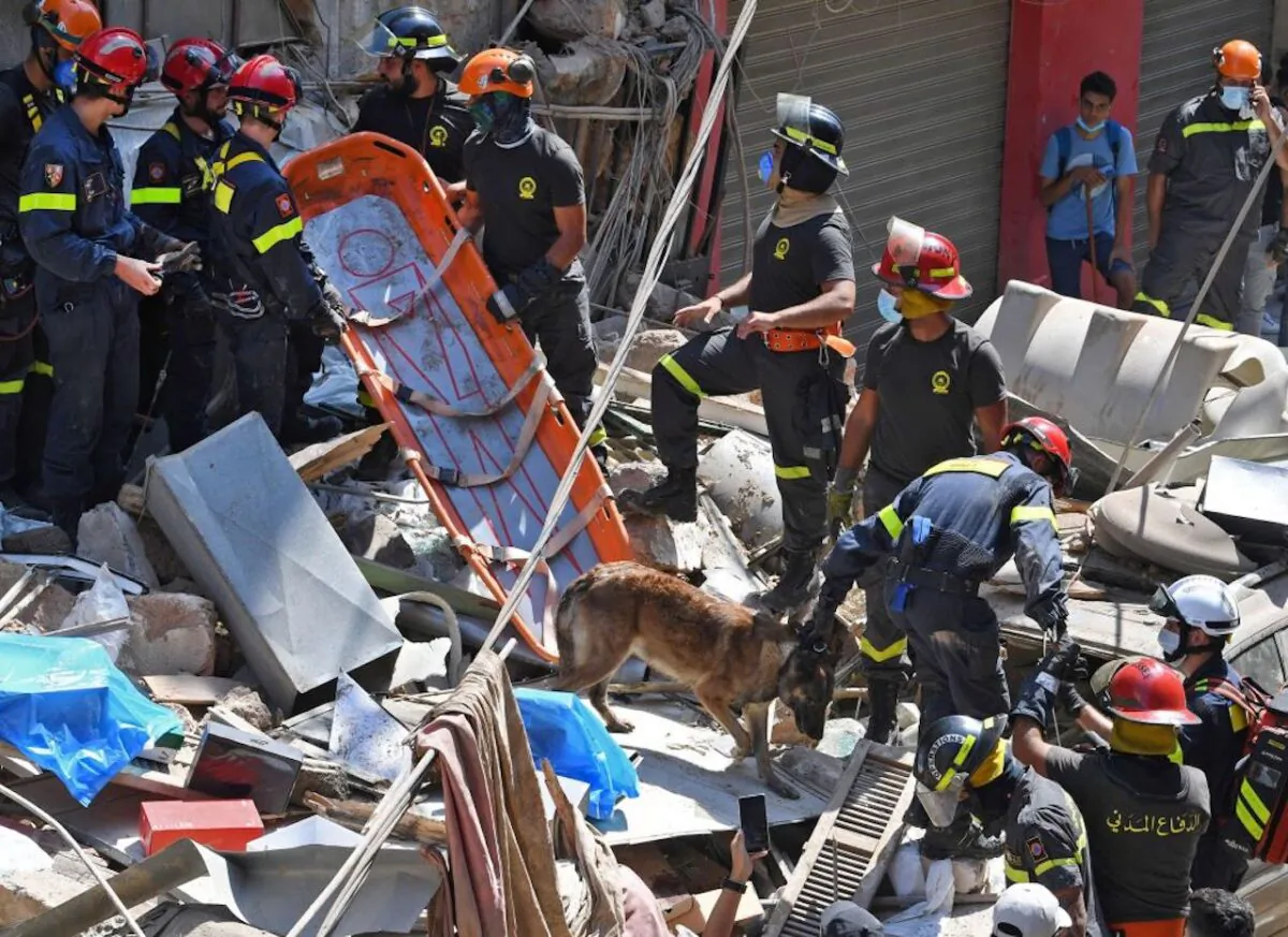 Lebanese and French rescuers search for victims or survivors amid the rubble of a building in the Gemayzeh neighborhood in Beirut, Lebanon, on Aug. 6, 2020. (AFP via Getty Images)