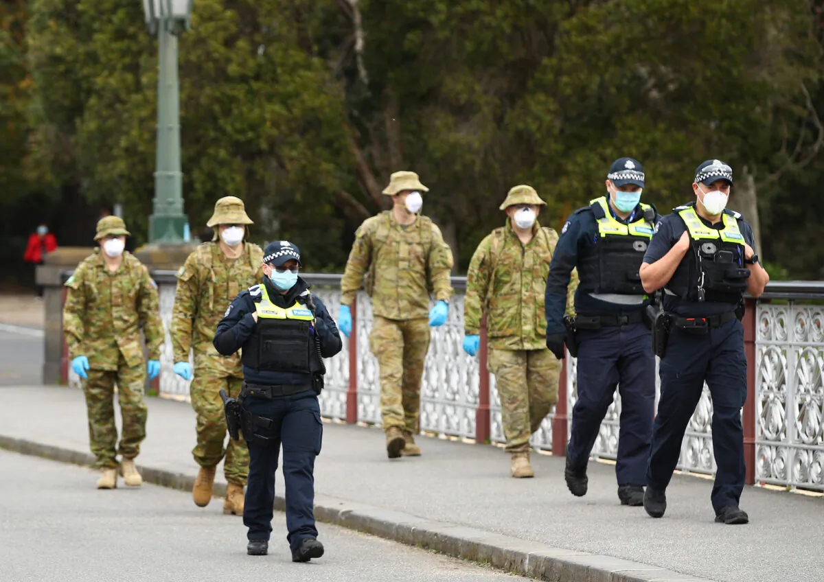 Police and the Australian military patrol the banks of the Yarra River in Melbourne, Australia on July 23, 2020. (Robert Cianflone/Getty Images)