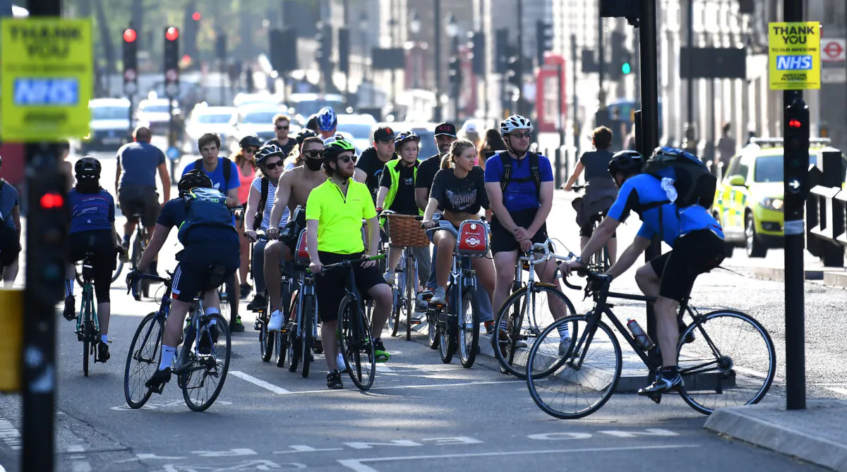 Cyclists wait at traffic lights in London on Apr. 23, 2020. (Alex Davidson/Getty Images)