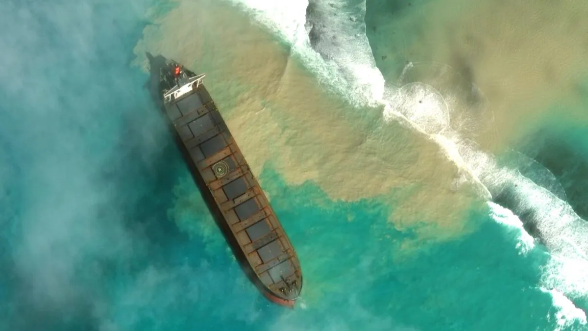 In this satellite image provided by 2020 Maxar Technologies on Aug. 7, 2020, an aerial view of the MV Wakashio, a bulk carrier ship that recently ran aground off the southeast coast of Mauritius. (2020 Maxar Technologies. via AP)