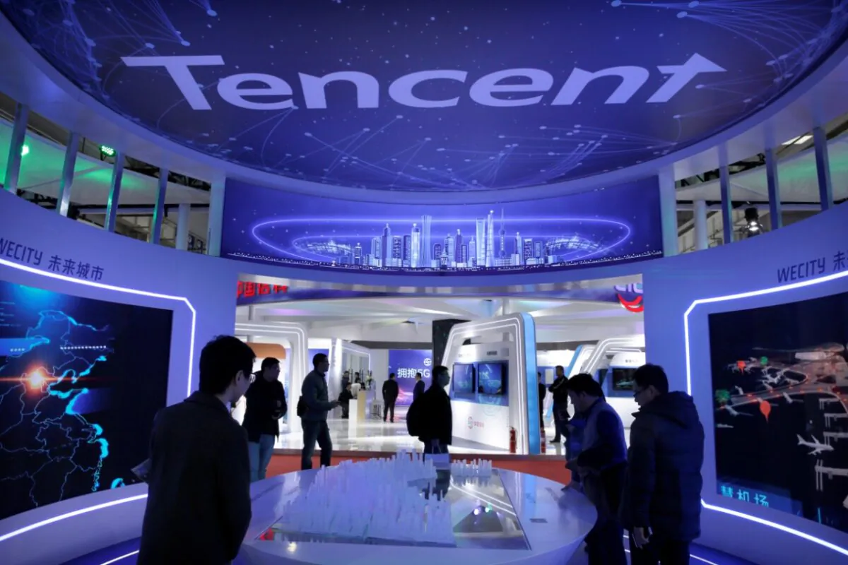 People visit Tencent's booth at the World 5G Exhibition in Beijing on Nov. 22, 2019. The Chinese internet giant is complying with Chinese leader Xi Jinping’s edict to redistribute the wealth in China. It is the largest holding in BMO’s Chinese ESG-focused ETF. (Jason Lee/Reuters)