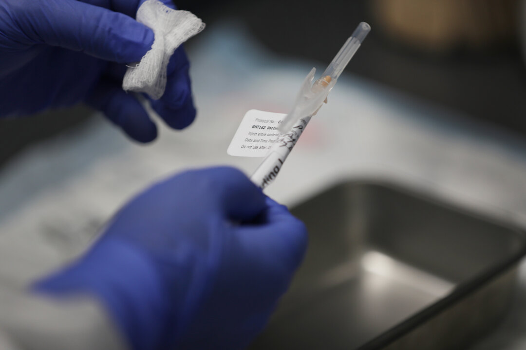 A nurse prepares a shot of COVID-19 vaccination at Research Centers of America in Hollywood, Fla., on Aug. 7, 2020. (Joe Raedle/Getty Images)