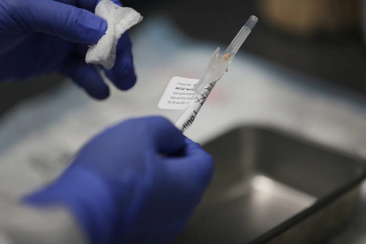 A nurse prepares a shot of COVID-19 vaccination at Research Centers of America in Hollywood, Fla., on Aug. 7, 2020. (Joe Raedle/Getty Images)