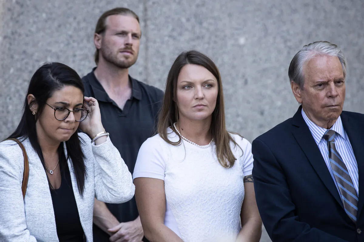 Courtney Wild (C), alleged victim of Jeffrey Epstein, looks on as her lawyers speak to the press at federal court following a bail hearing for Jeffrey Epstein, in New York City on July 15, 2019. (Drew Angerer/Getty Images)