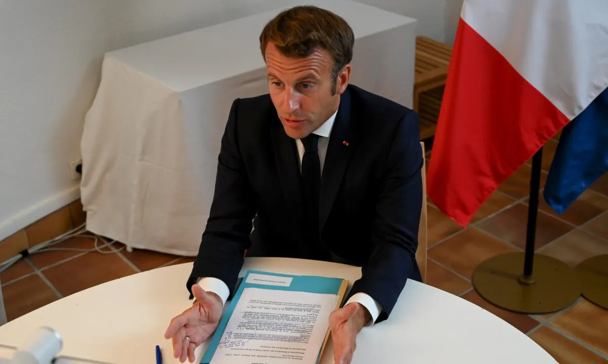 French President Emmanuel Macron speaks during a donor teleconference with other world leaders concerning the situation in Lebanon following the Beirut blast, in Fort de Bregancon in Bormes-les-Mimosas, France, on Aug. 9, 2020. (Christophe Simon/Pool via Reuters)
