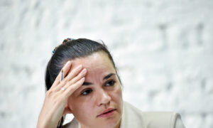 Belarusian Opposition Leader Flees Abroad After Bloody Clashes