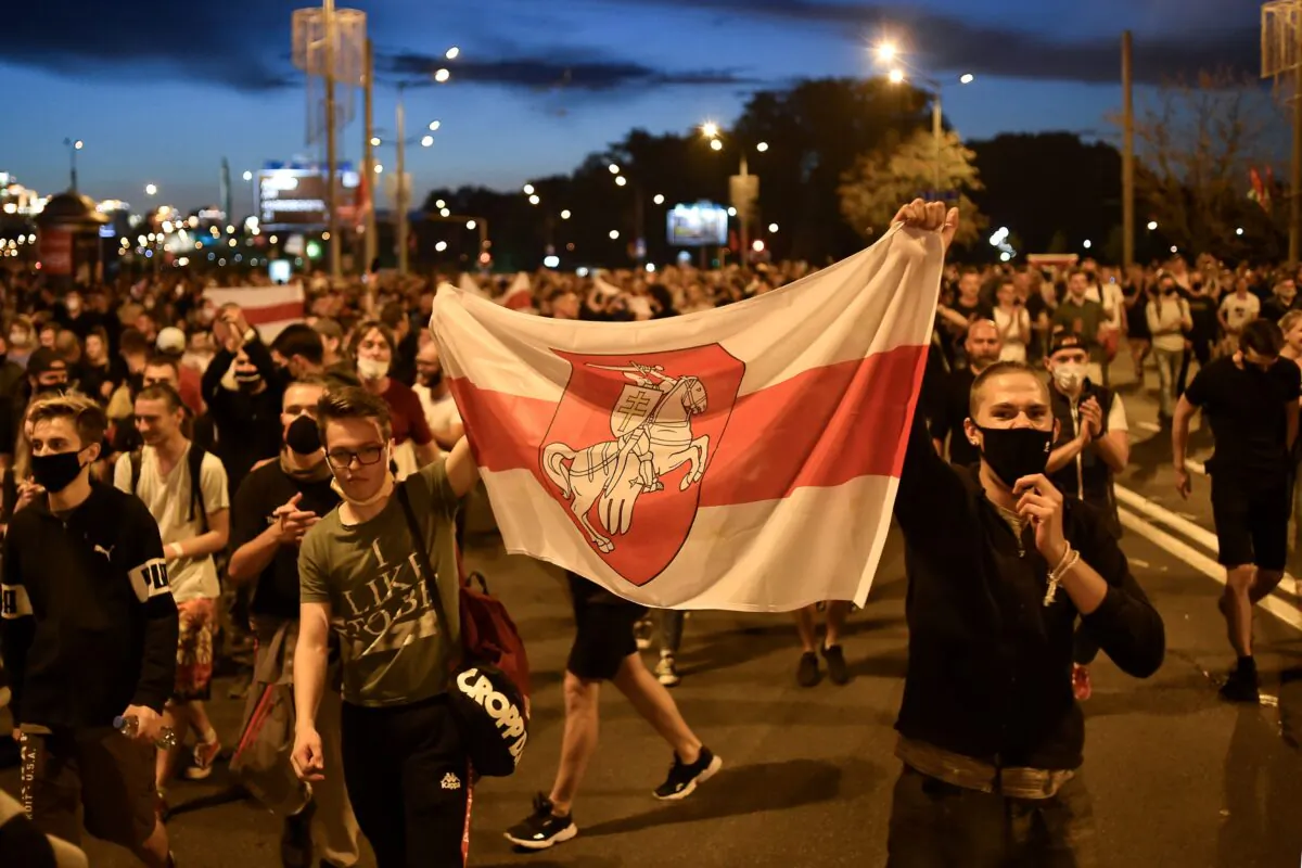 Opposition supporters protest after polls closed in Belarus' presidential election, in Minsk, on Aug. 9, 2020. (Sergei Gapon/AFP via Getty Images)