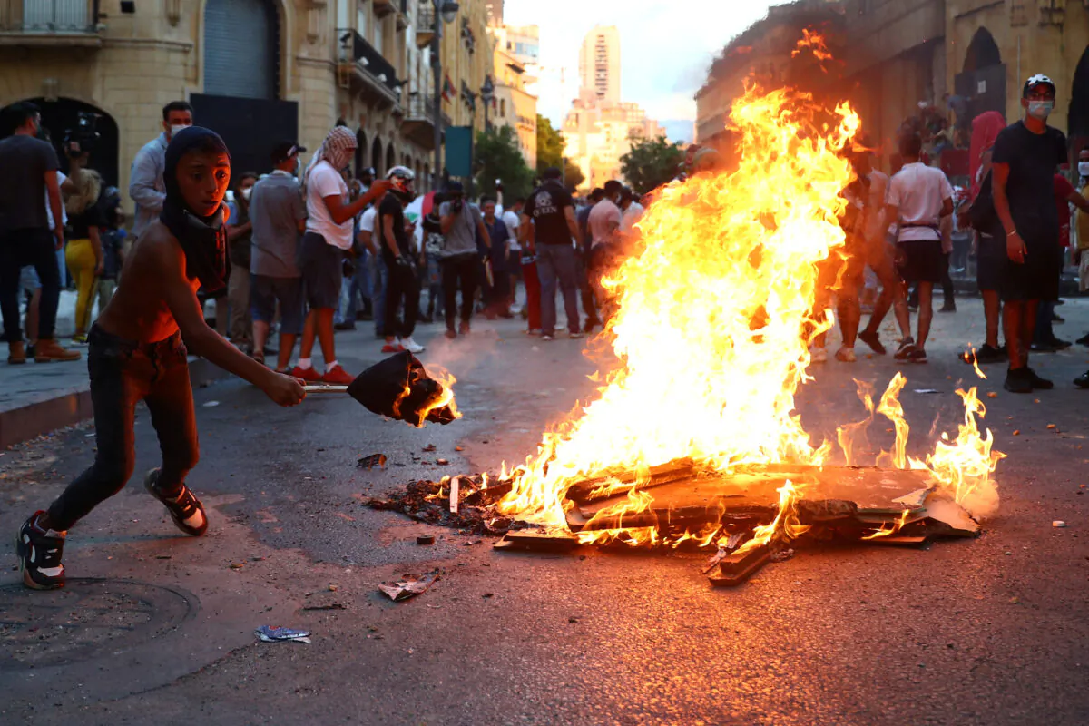 Demonstrators take part in anti-government protests that have been ignited by a massive explosion in Beirut, Lebanon, on Aug. 10, 2020. (Hannah McKay/Reuters)