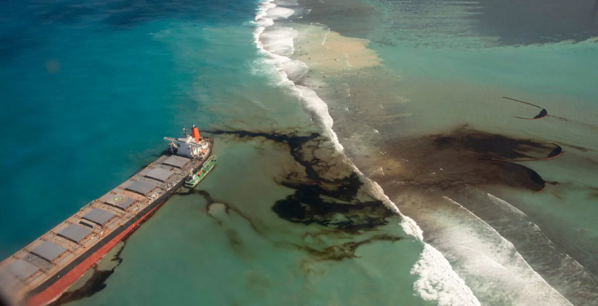 The French Defense Ministry shows oil leaking from the MV Wakashio, a bulk carrier ship that recently ran aground off the southeast coast of Mauritius on Aug.9, 2020. (Gwendoline Defente/EMAE via AP)