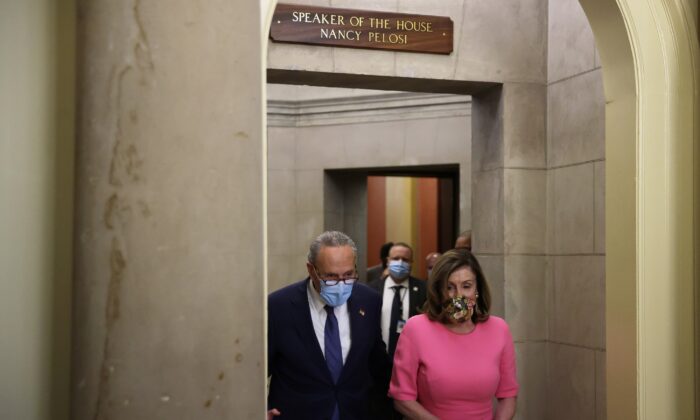 (L) Then-Senate Minority Leader Chuck Schumer (D-N.Y.) and (R) House Speaker Nancy Pelosi (D-Calif.) walk to speak to reporters after meeting with White House officials at the U.S. Capitol in Washington on Aug. 7, 2020. (Alex Wong/Getty Images)