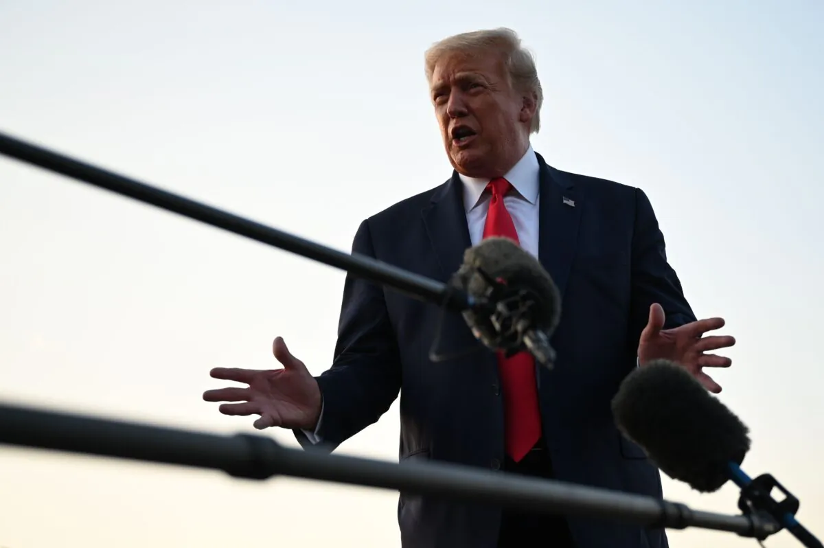 President Donald Trump takes questions from the media on the tarmac at Morristown Municipal Airport in Morristown, N.J., on Aug. 9, 2020. (Jim Watson/AFP via Getty Images)