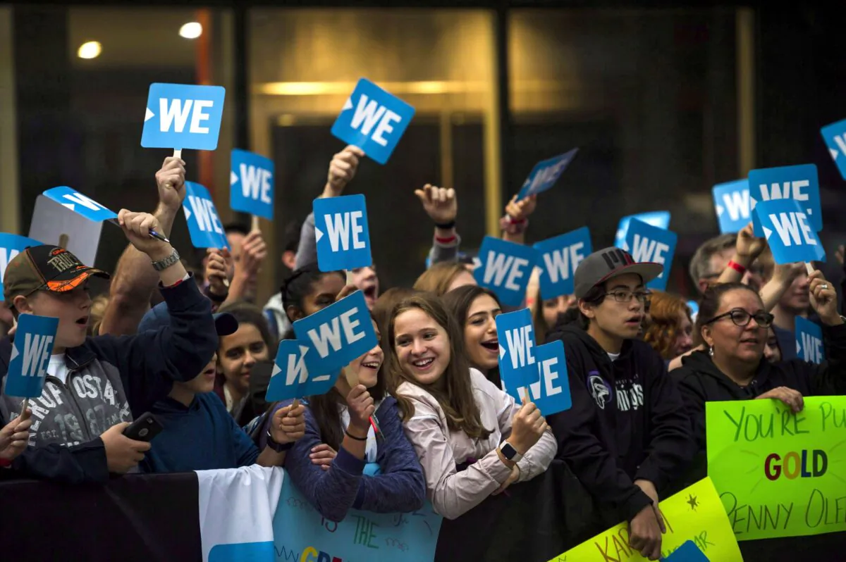 A crowd gathers by the red carpet before a WE Day event in Toronto on Sept. 20, 2018. (The Canadian Press/Christopher Katsarov)