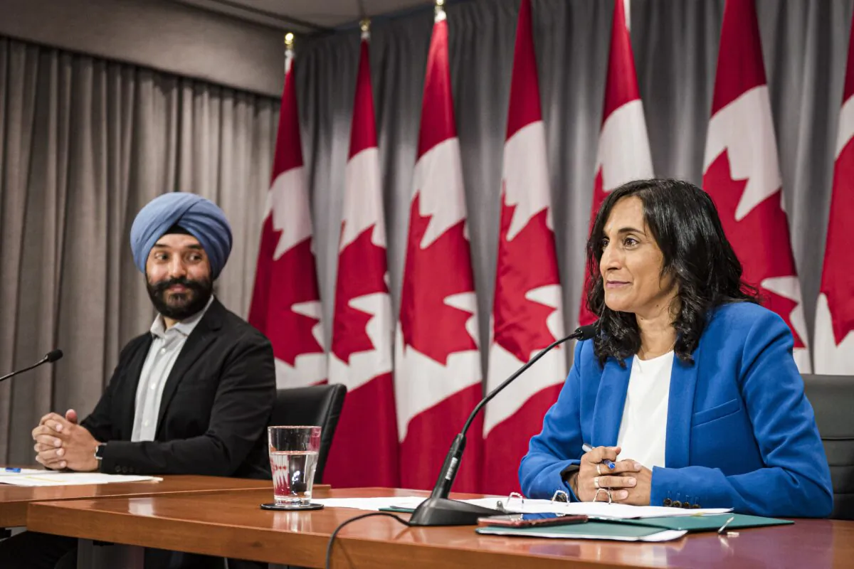 Innovation Minister Navdeep Bains and Minister of Public Services and Procurement Anita Anand make an announcement regarding vaccine procurement in Toronto on Aug., 5, 2020. (The Canadian Press/Christopher Katsarov)