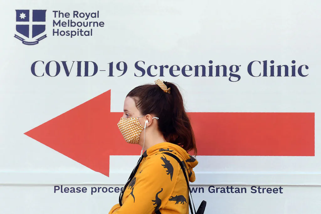 A woman queues outside a COVID-19 coronavirus testing venue at The Royal Melbourne Hospital in Melbourne on July 16, 2020. (WILLIAM WEST/ Getty Images)
