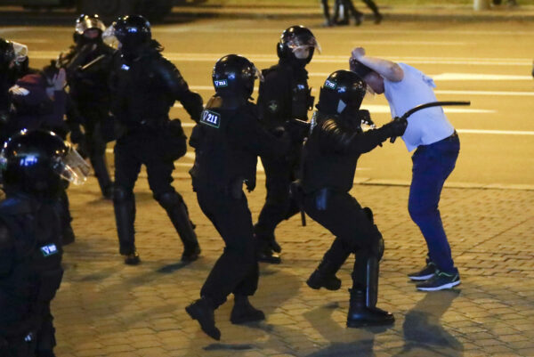 Police use truncheons on protesters Minsk Belarus