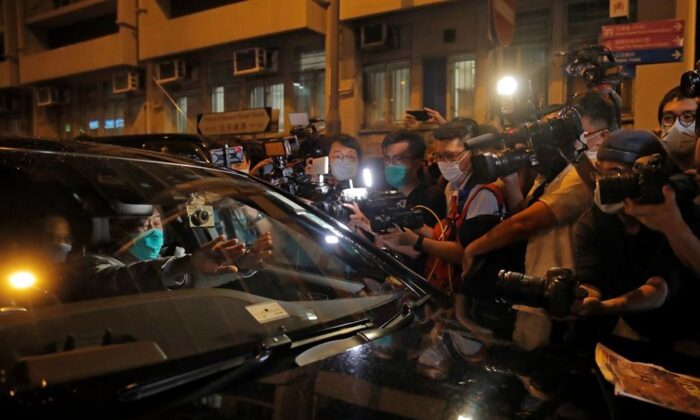 Hong Kong media tycoon and newspaper founder Jimmy Lai, sits in a car as he leaves a police station after being bailed out in Hong Kong on Aug. 12, 2020. The rounding up of the paper’s founder Jimmy Lai, the previous day and a raid on its headquarters have reinforced fears that a new national security law will be used to suppress dissent in Hong Kong after months of anti-government protests. (AP Photo/Kin Cheung)