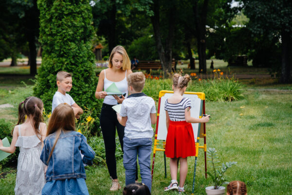 teacher and students outdoors