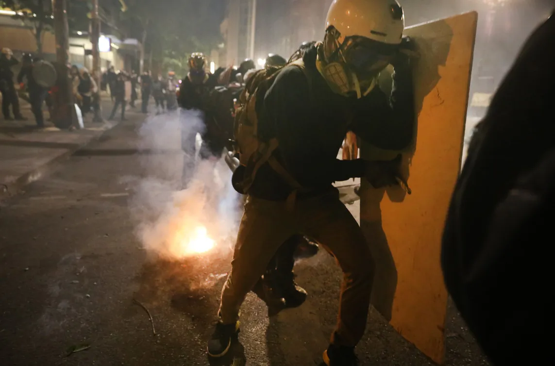 Protesters clash with federal police in front of the Mark O. Hatfield federal courthouse in downtown Portland, Ore., as the city experiences another night of unrest on July 28, 2020. (Spencer Platt/Getty Images)