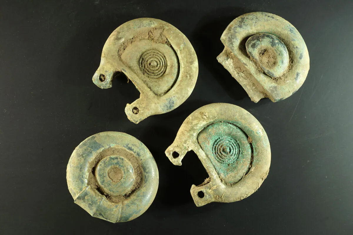 Objects found by metal detectorist Mariusz Stepien in the Scottish Borders, in an undated photo. (Crown Office Communications via AP)