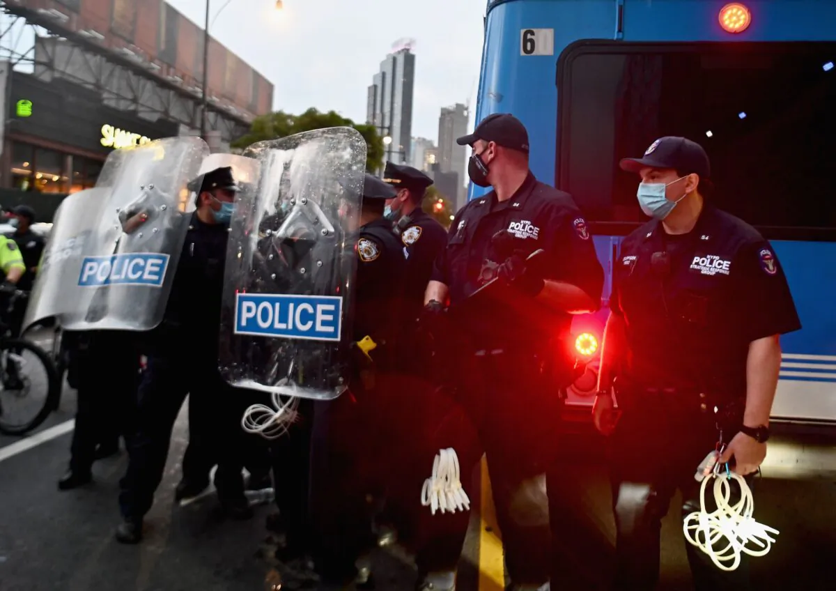 NYPD officers stand guard during a "Black Lives Matter" protest near Barclays Center in the Brooklyn borough of New York City on May 29, 2020. (Angela Weiss/AFP via Getty Images)