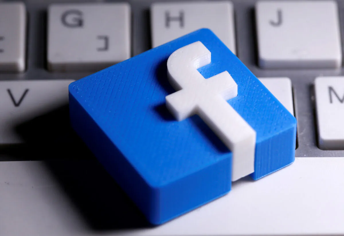 A 3D-printed Facebook logo is seen placed on a keyboard in this illustration taken on March 25, 2020. (Dado Ruvic/Illustration/Reuters)