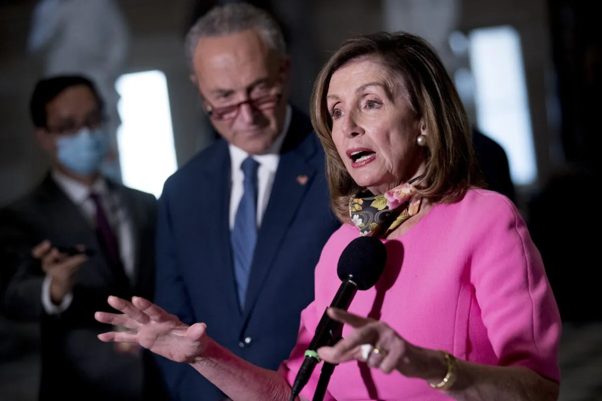 House Speaker Nancy Pelosi (D-Calif.), accompanied by Senate Minority Leader Chuck Schumer (D-N.Y.), speak to reporters following a meeting with Treasury Secretary Steven Mnuchin and White House chief of staff Mark Meadows as they negotiate a CCP virus relief package, on Capitol Hill in Washington on Aug. 7, 2020. (Andrew Harnik/AP Photo)