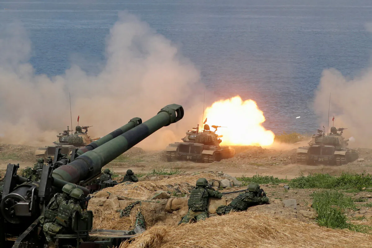 A CM-11 Brave Tiger tank fires during the live fire Han Kuang military exercise, which simulates China's People's Liberation Army (PLA) invading the island, in Pingtung, Taiwan, on May 30, 2019. (Tyrone Siu/Reuters)