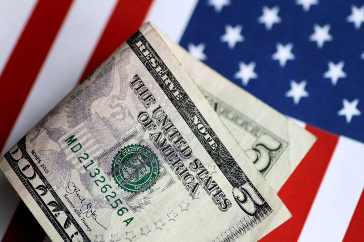 A U.S. $5 bill is seen in this illustration photo, on June 1, 2017. (Thomas White/Illustration via Reuters)