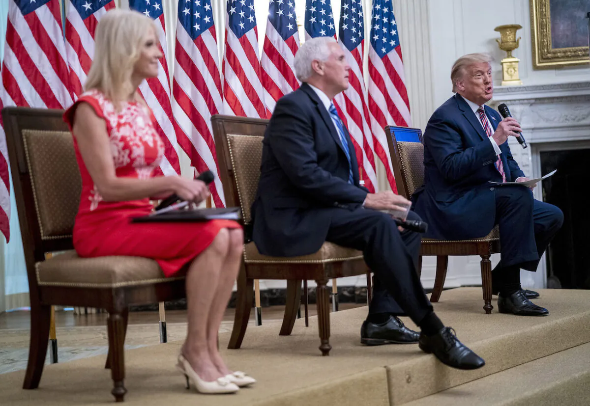 President Donald Trump with Vice President Mike Pence and Kellyanne Conway as they participate in "Kids First: Getting America’s Children Safely Back to School" event at the White House, on Aug. 12, 2020. (Doug Mills/The New York Times via Getty Images)