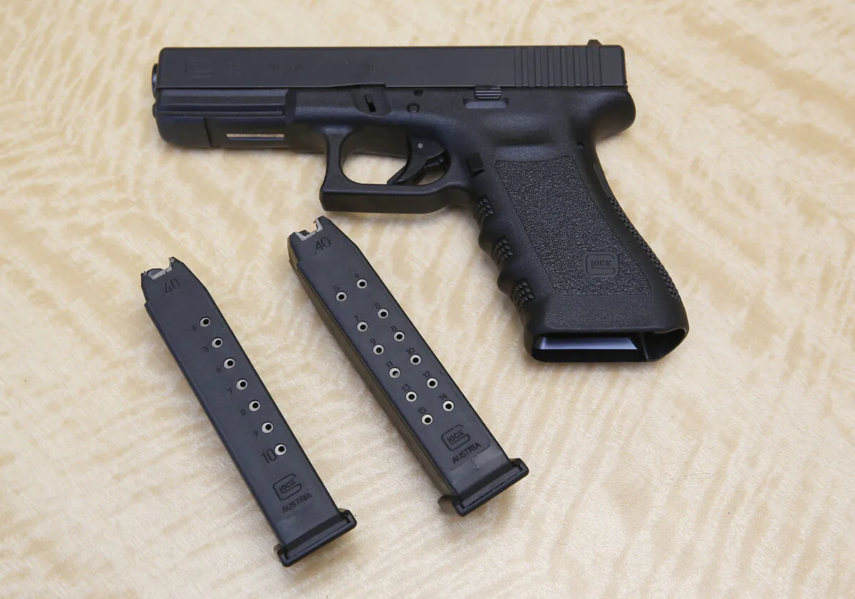 A Glock handgun and two magazines in a file photograph. (Rich Pedroncelli/AP Photo)