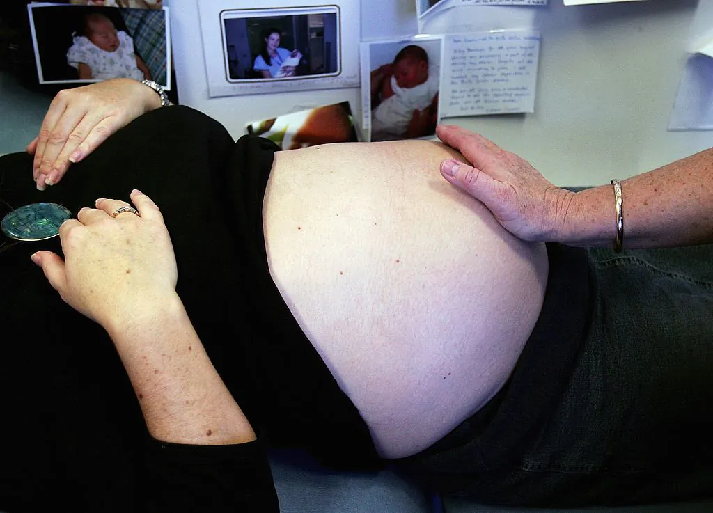 A midwife checks the condition of a pregnant woman during a routine check-up at Royal North Shore Hospital's Birth Centre June 7, 2006 in Sydney, Australia. (Ian Waldie/Getty Images)