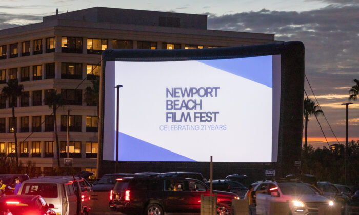 Cars line up for a rooftop screening of "A Life of Endless Summers:  Bruce Brown Story" hosted by the Newport Beach Film Festival in Newport Beach, Calif., on Aug. 13, 2020. (John Fredricks/  Pezou)