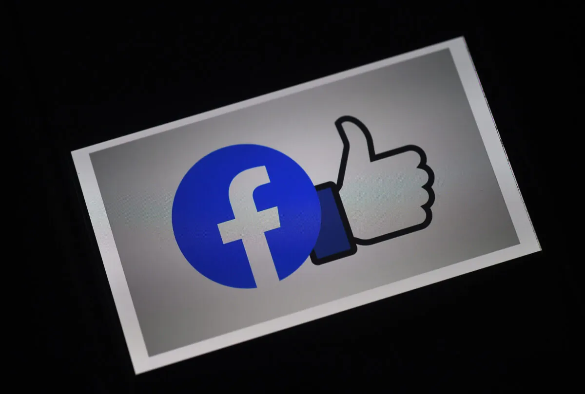 In this photo illustration a Facebook App logo is displayed on a smartphone in Arlington, Va. on March 25, 2020. (Olivier Douliery/AFP via Getty Images)