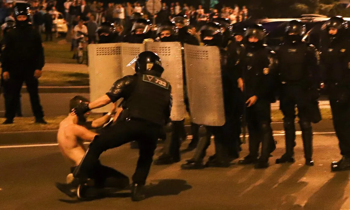 A police officer detains a protester after the presidential election in Minsk, Belarus, on Aug. 10, 2020. (AP Photo)