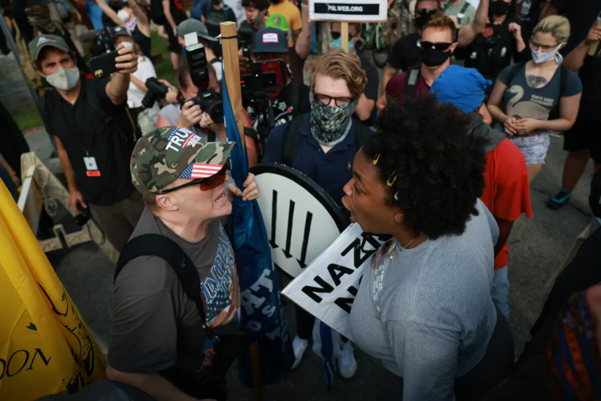 A woman argues with a protester during a rally in support of Confederate monuments in Stone Mountain, Ga., on Aug. 15, 2020. (Lynsey Weatherspoon/Getty Images)