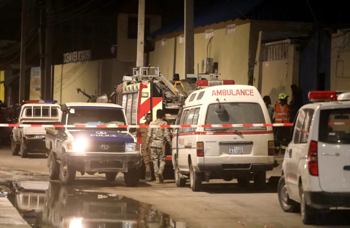 Emergency vehicles are seen at a cordoned off area near the site of a blast at the Elite Hotel in Lido beach in Mogadishu, Somalia, on Aug. 16, 2020. (Reuters/Feisal Omar)