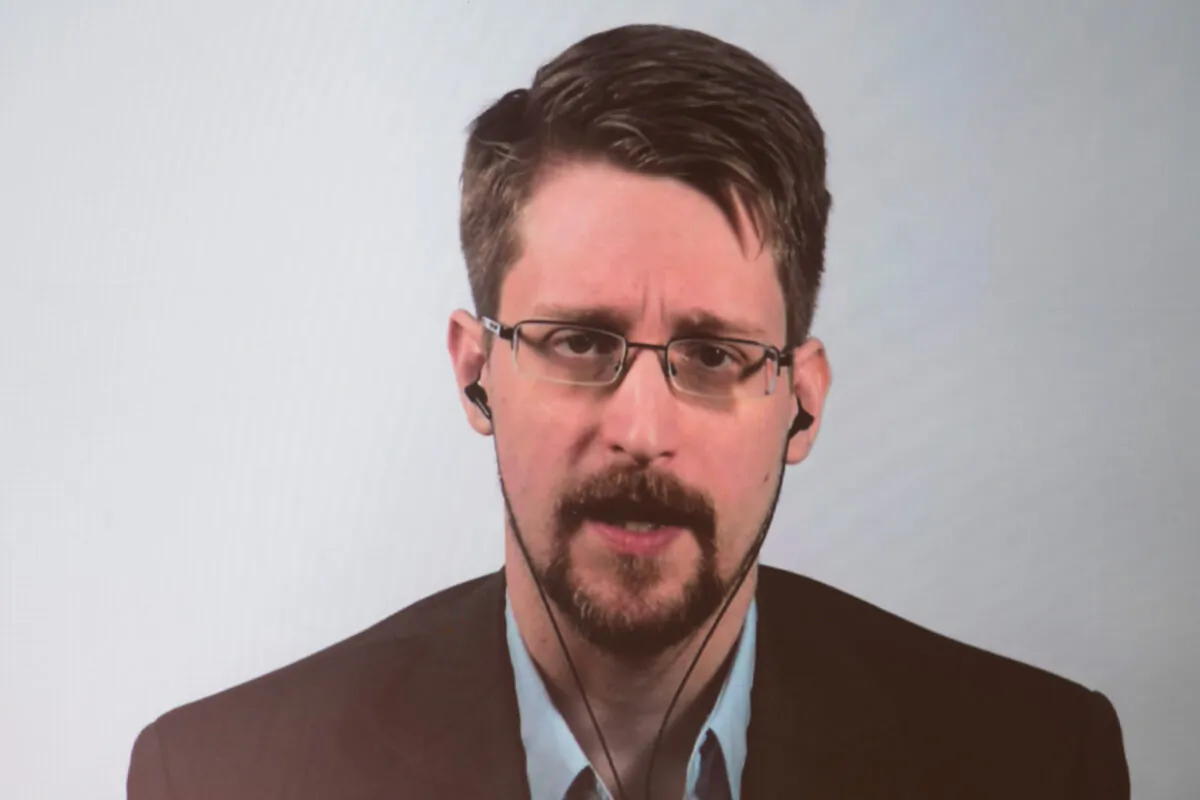 Former CIA employee and whistleblower Edward Snowden is displayed on a screen as he speaks during a video conference to present his book titled "Permanent Record," in Berlin, Germany, on Sept. 17, 2019. (Jörg Carstensen//DPA/AFP via Getty Images)