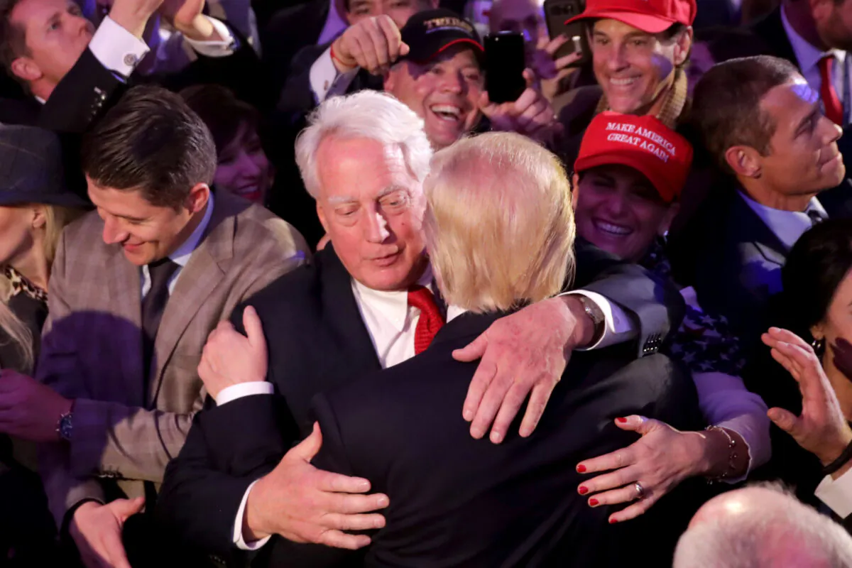 Then-president-elect Donald Trump (R) hugs his brother Robert Trump after delivering his acceptance speech at the New York Hilton Midtown in New York City in the early morning hours of Nov. 9, 2016. (Chip Somodevilla/Getty Images)
