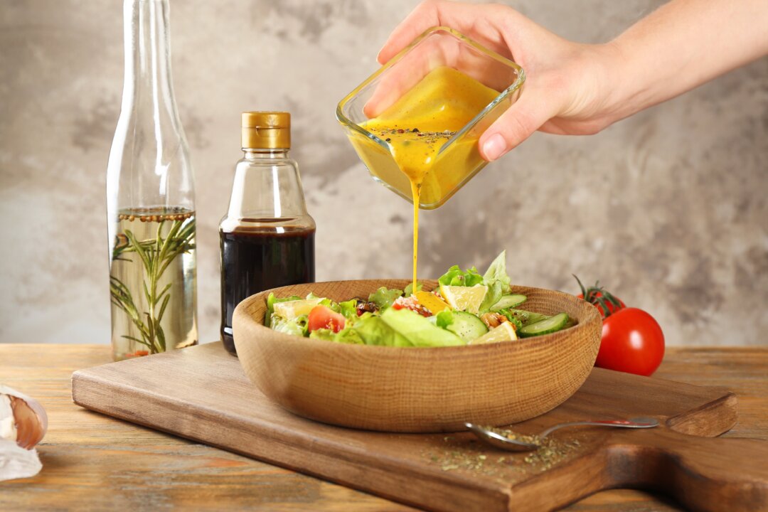 Homemade salad dressing is easy to make and vastly healthier than most store-bought varieties. (Africa Studio/Shutterstock)