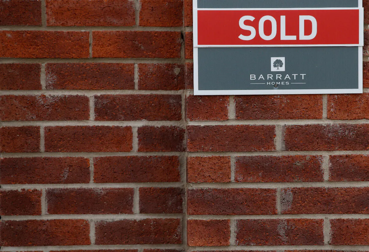 File photo of a 'Sold' sign is seen on the wall of a house in a new Barratt Homes housing development near Warrington, Britain, on Aug. 6, 2020. (Reuters/Phil Noble/File Photo)