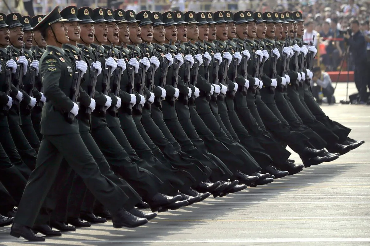 Soldiers from the People's Liberation Army march in formation during a parade to commemorate the 70th anniversary of the founding of communist China, in Beijing on Oct. 1, 2019. (AP Photo/Mark Schiefelbein)