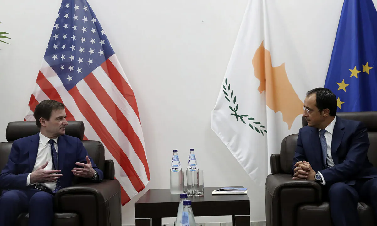 Cyprus' foreign minister Nikos Christodoulides, right, talks with Under Secretary of the United States of America, for Political Affairs, David Hale during their meeting at Larnaca international airport, Cyprus, on Aug. 16, 2020. (Christos Avraamides/Press and Information Office of Cyprus via AP Photo)