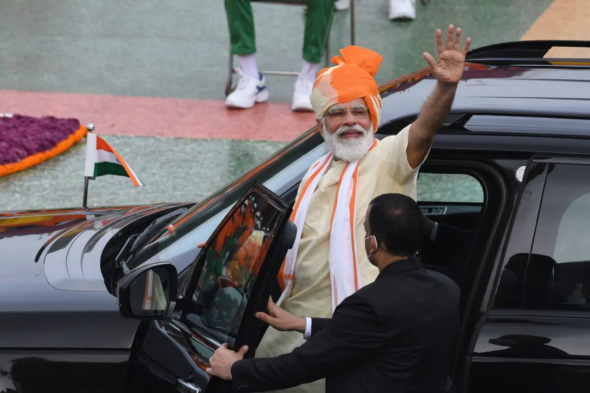 India's Prime Minister Narendra Modi waves as he leaves in a car after his speech to the nation during a ceremony to celebrate India's 74th Independence Day, which marks the end of British colonial rule, at the Red Fort in New Delhi on Aug. 15, 2020. India's Prime Minister Narendra Modi issued a new warning to China over deadly border tensions on August 15, using his most important speech of the year to promise to build a stronger military. (PRAKASH SINGH/AFP via Getty Images)