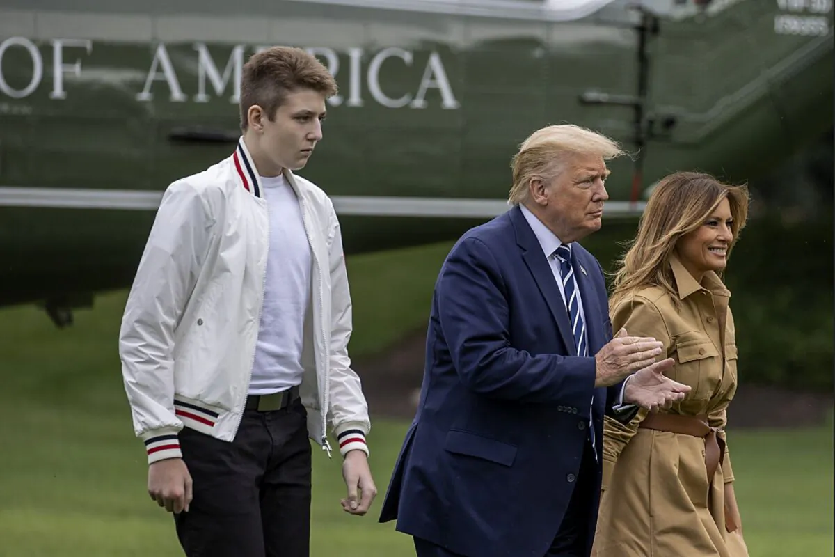 Barron Trump, US President Donald Trump and First lady Melania Trump walk on the South Lawn of the White House on August 16, 2020 in Washington, DC. Robert Trump, 71, the younger brother of the president, died Saturday in Manhattan. (Photo by Tasos Katopodis/Getty Images)