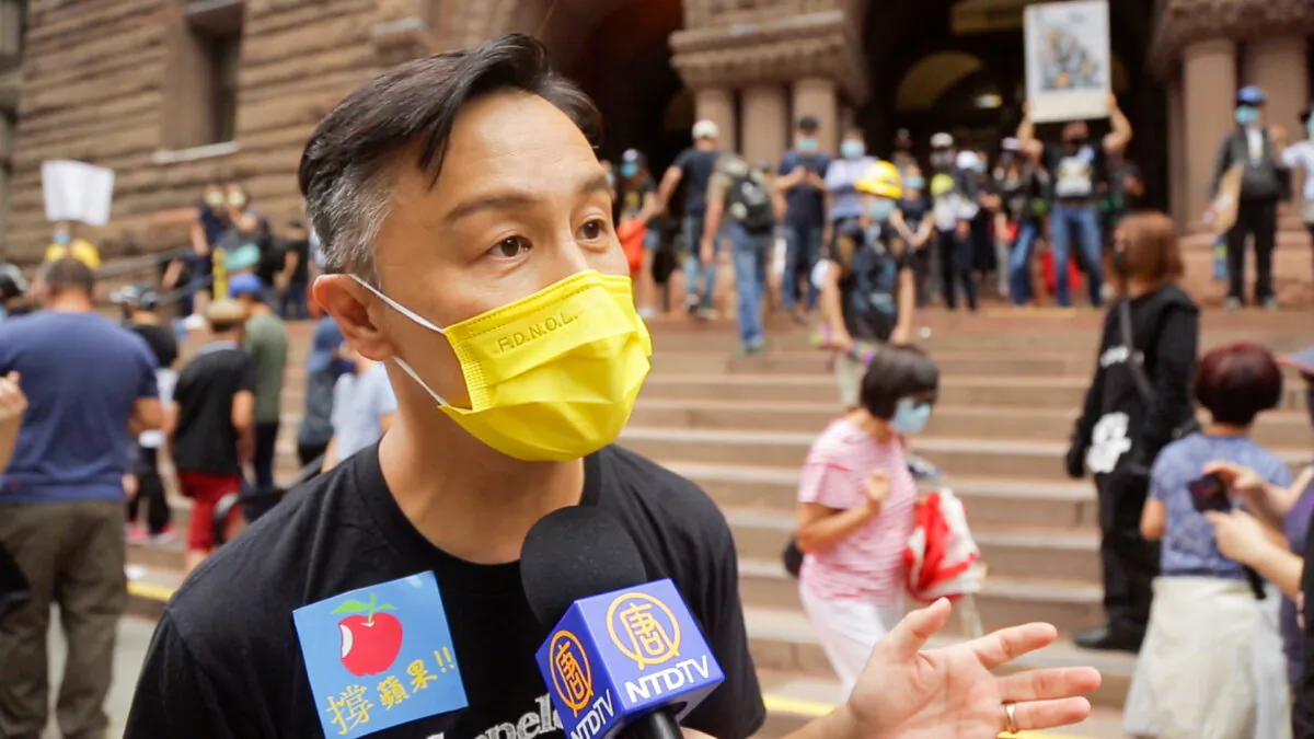 Fromer Hong Kong entertainer Joe Tay King-kei being interviewed at a rally in Toronto, Canada on Aug. 16, 2020. (NTD Television)