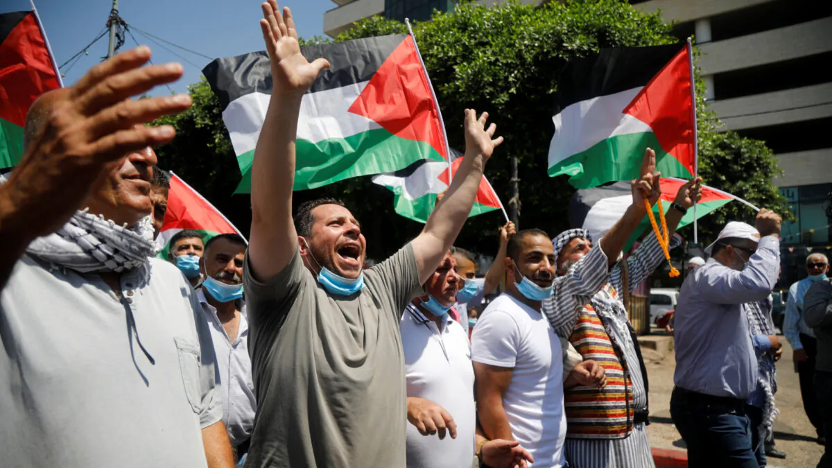 Palestinians take part in a protest against the United Arab Emirates' deal with Israel to normalise relations, in Nablus in the Israeli-occupied West Bank on Aug. 14, 2020. (Reuters/Raneen Sawafta)