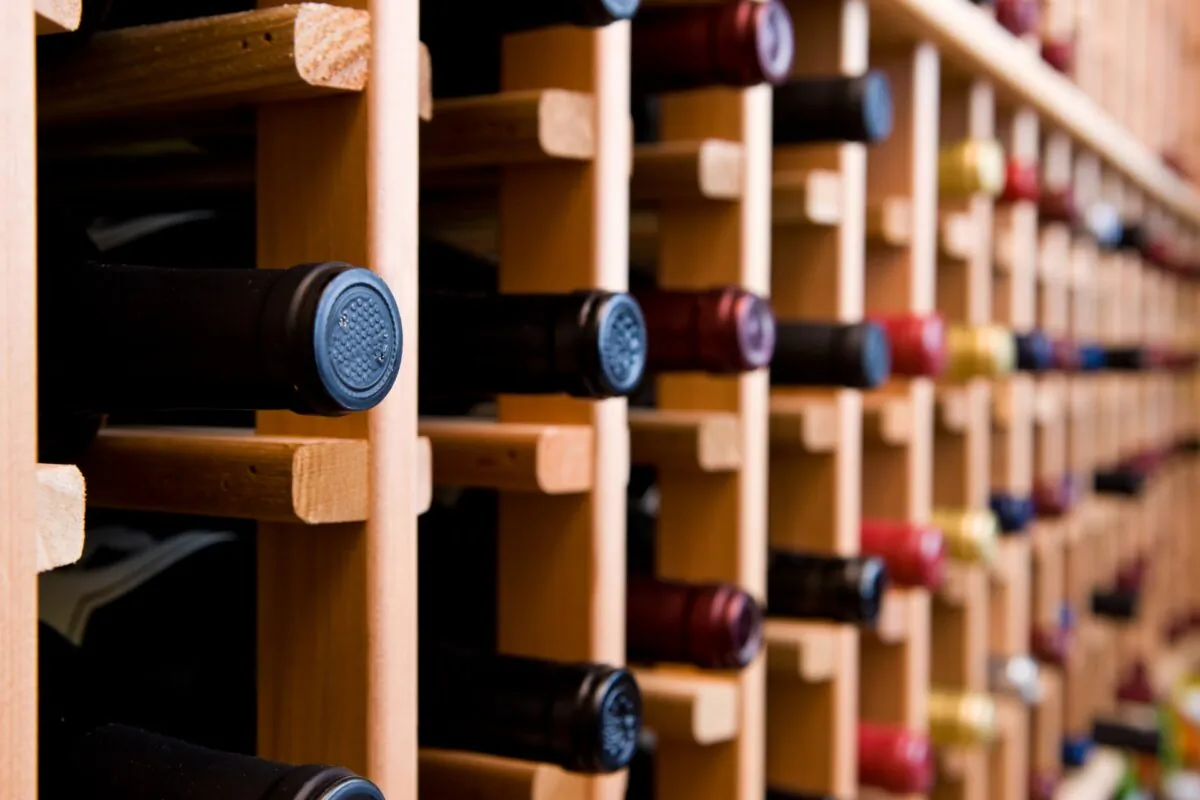 Start small, and you might find yourself working your way up to buying wooden wine racks and a refrigerated wine cabinet in no time. (Hdc Photo/Shutterstock)