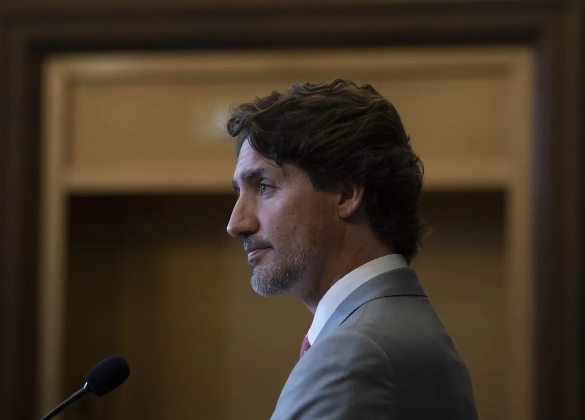 Prime Minister Justin Trudeau listens to a question during a news conference on parliament hill in Ottawa on Aug. 18, 2020. (Adrian Wyld/The Canadian Press)