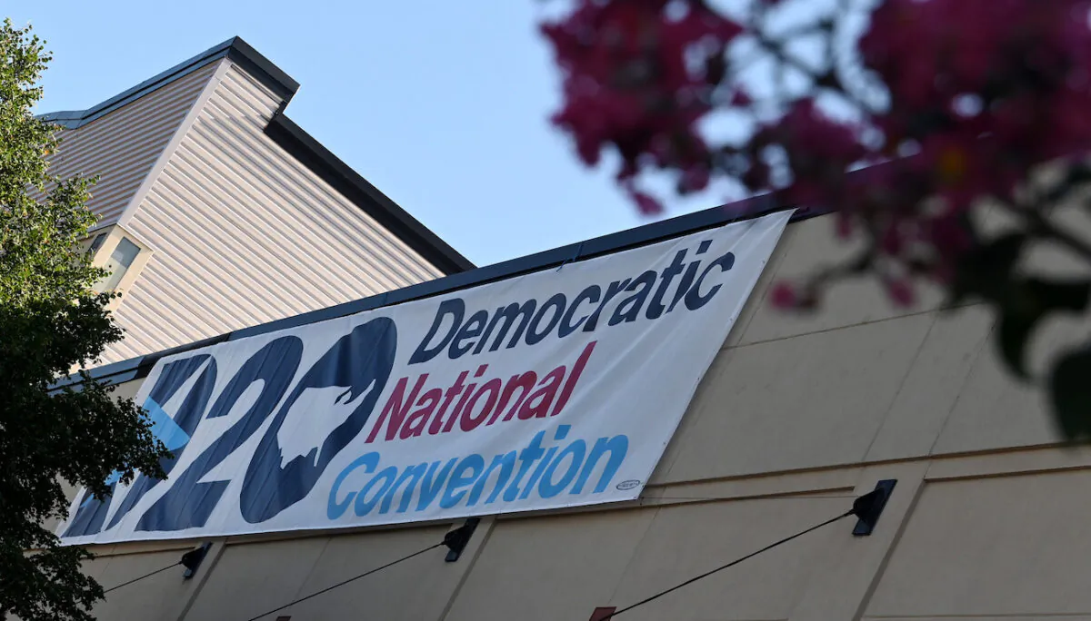 A banner of the Democratic National Convention hangs outside the Chase Center in Wilmington, Del., on Aug. 17, 2020. (Olivier Douliery/AFP via Getty Images)
